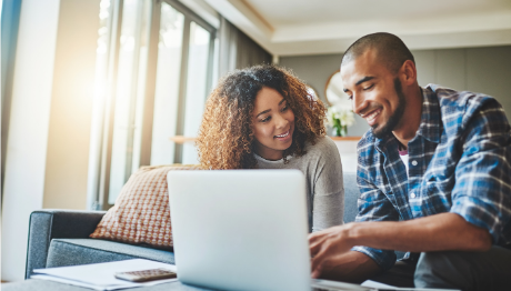 Young couple applying for a loan on their laptop