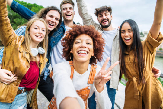 A group of friends celebrate their credit union membership in Maryland.