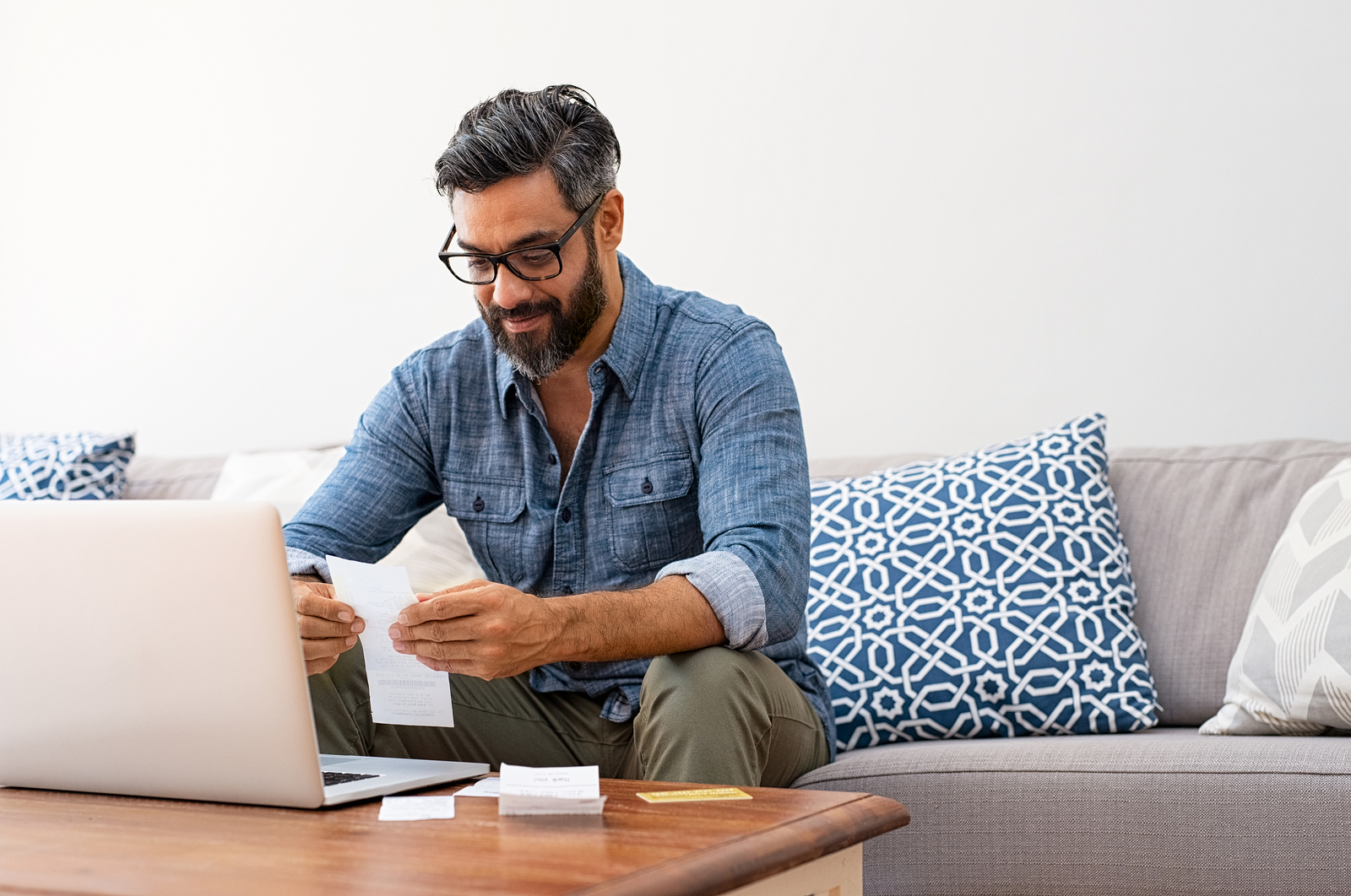 man comparing checking account features