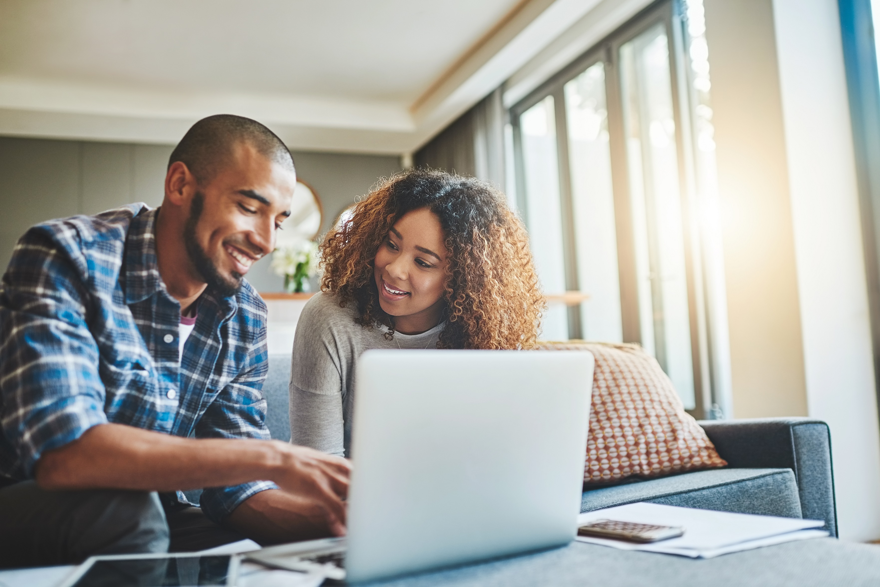 Young couple in front of laptop