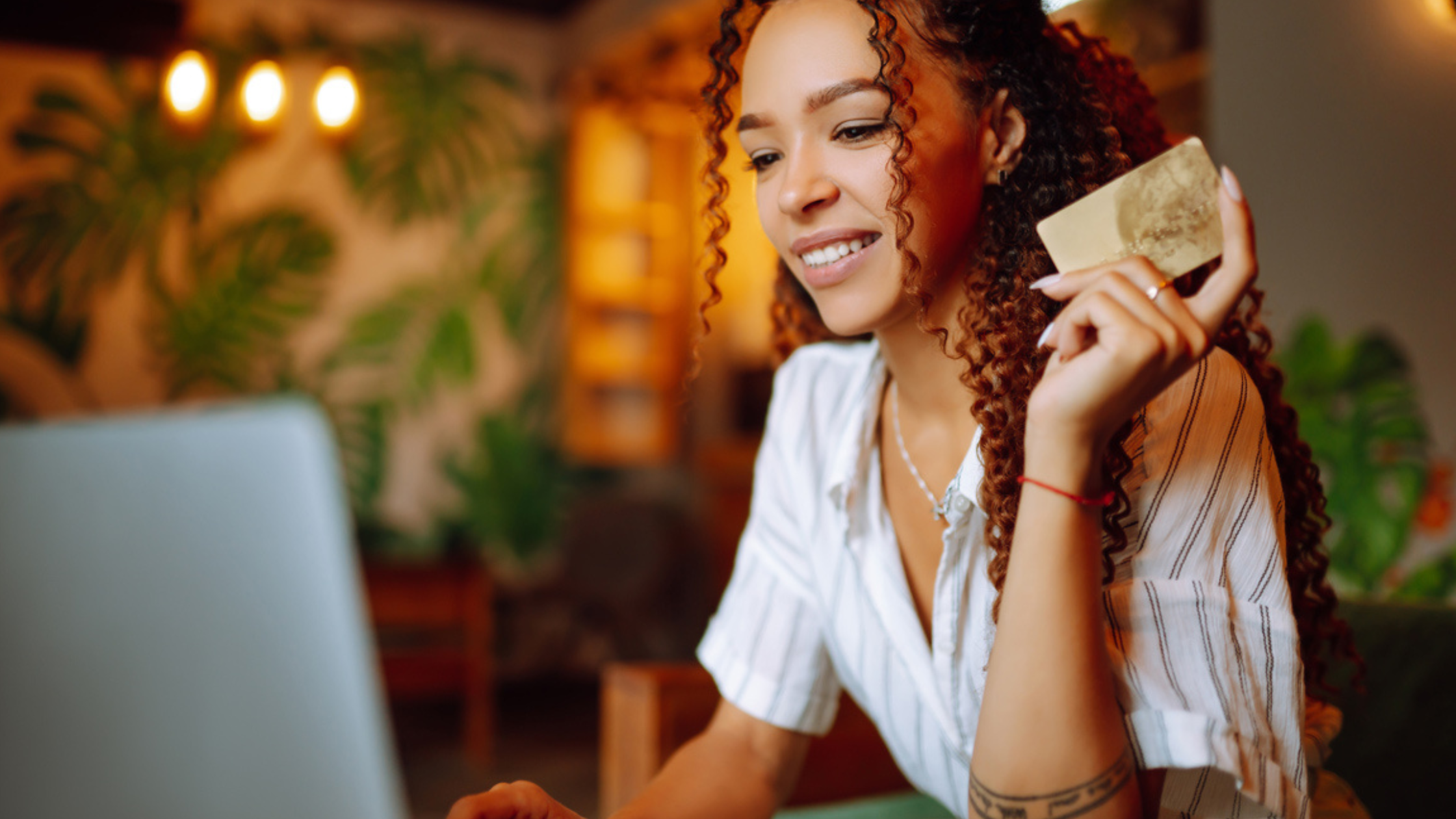 Young lady shopping online with credit card