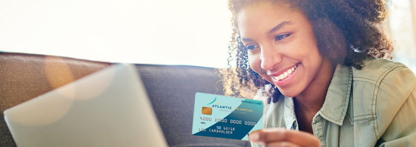 Young lady making online purchase with AFFCU visa credit card