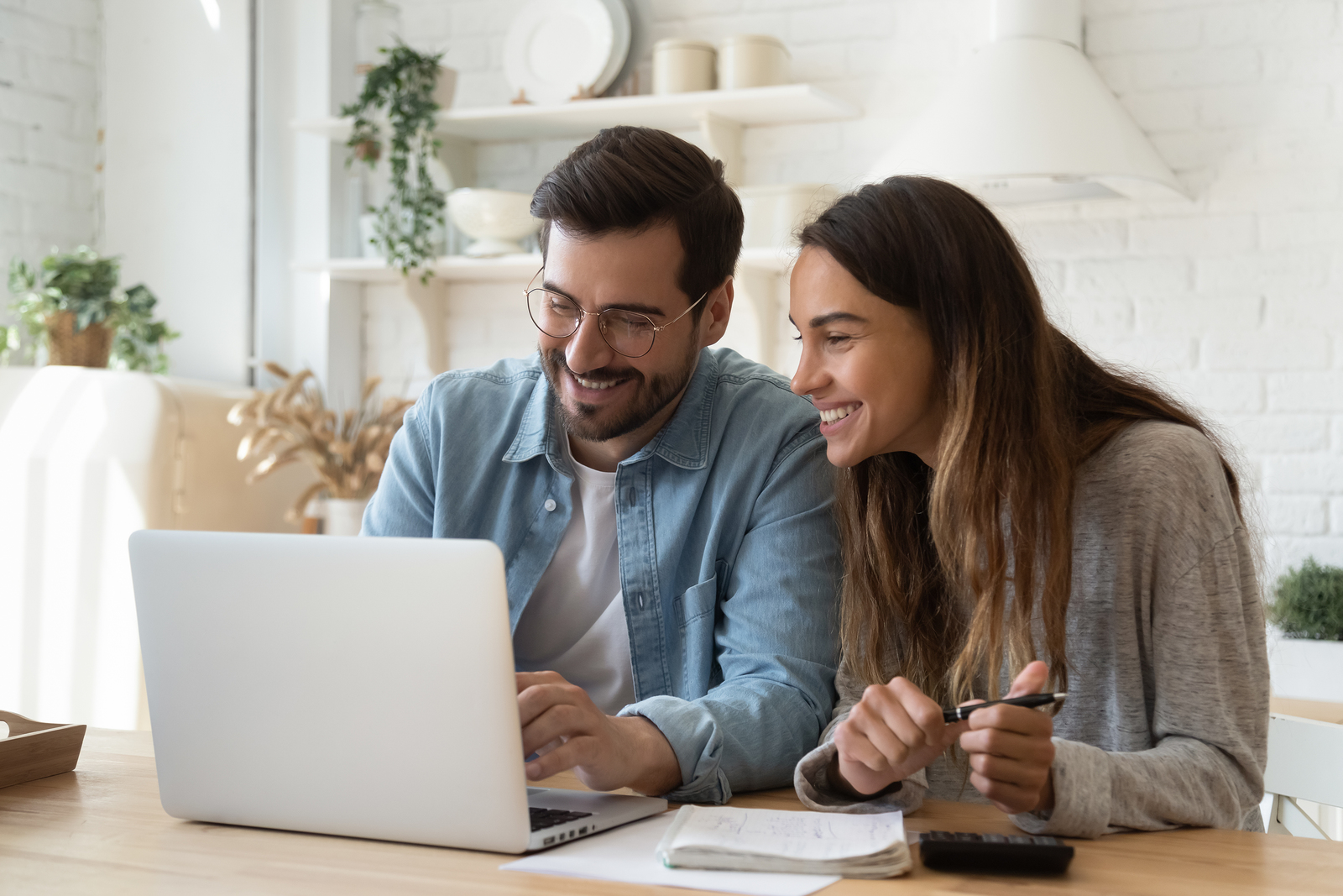 a couple with their checking account requirements opening an account online from home