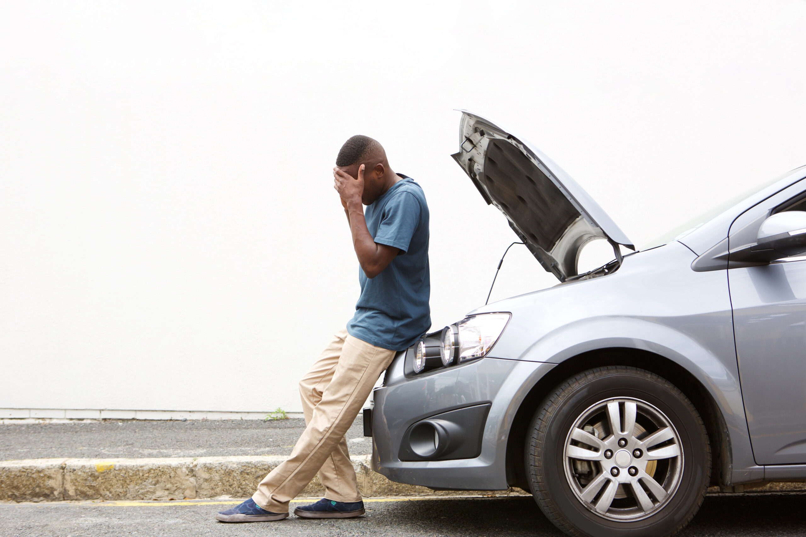 A man worries about how to handle a financial crisis when his car breaks down