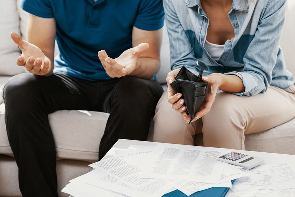 frustrated couple debating money management tips