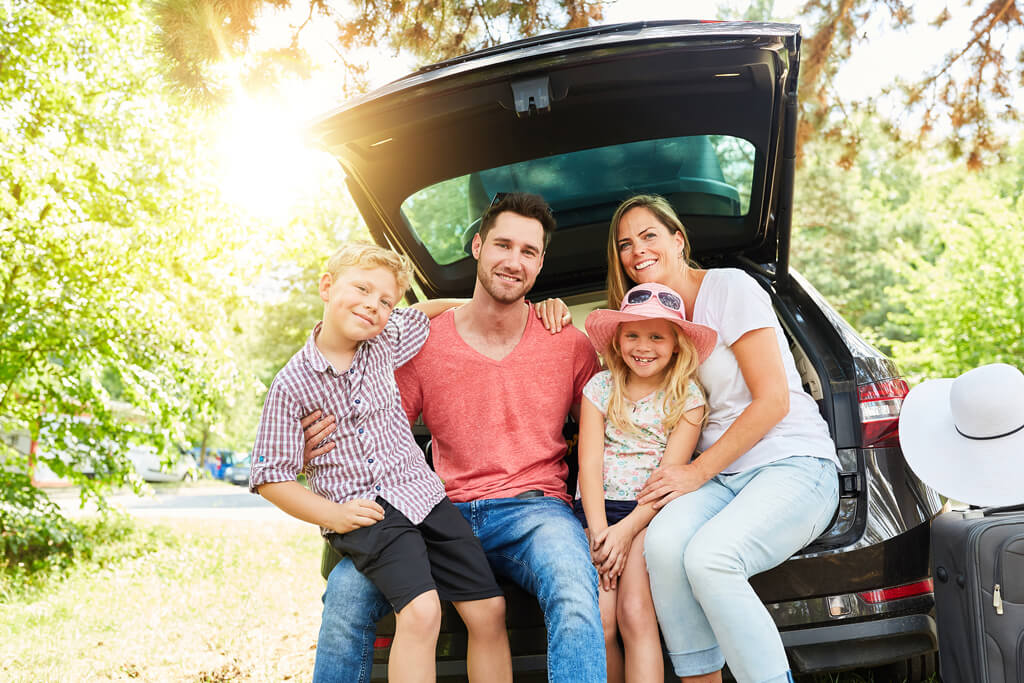 happy family driving off with new vehicle private seller car loan